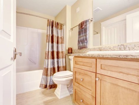 Bathroom with shower curtain over the tub