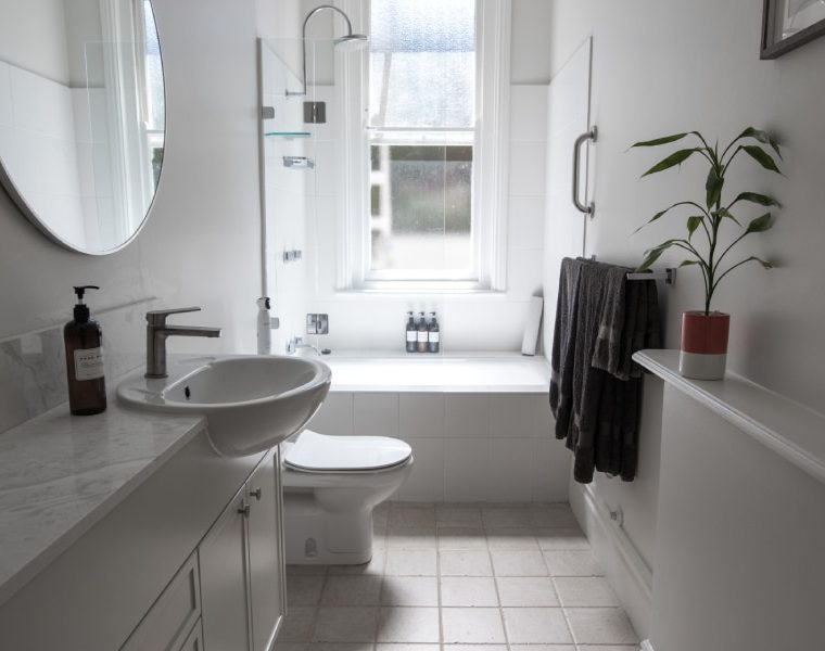 Bathroom with a fitted bathtub and basin