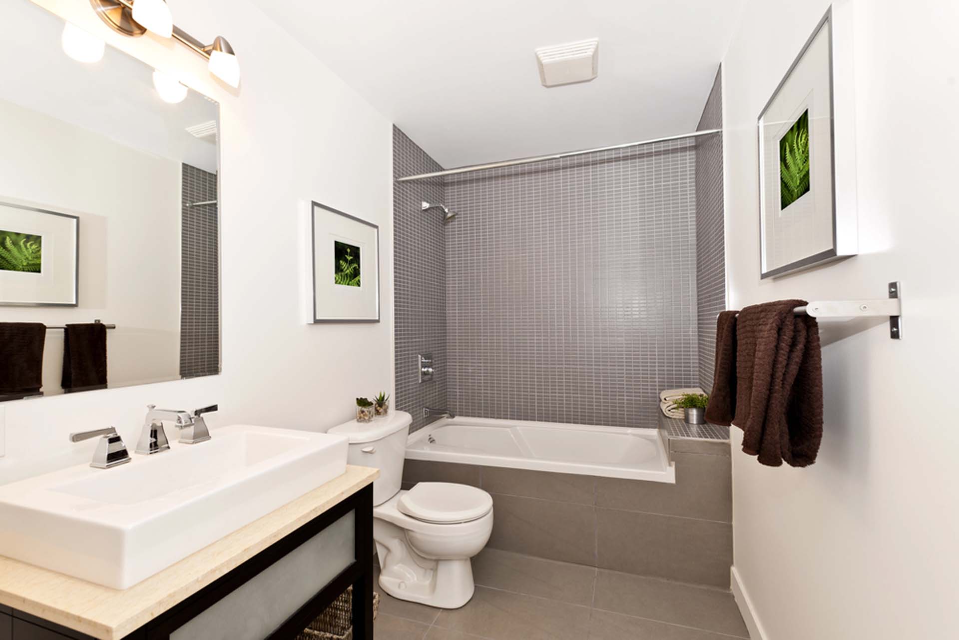 Remodelled bathroom with a tiled tub surround