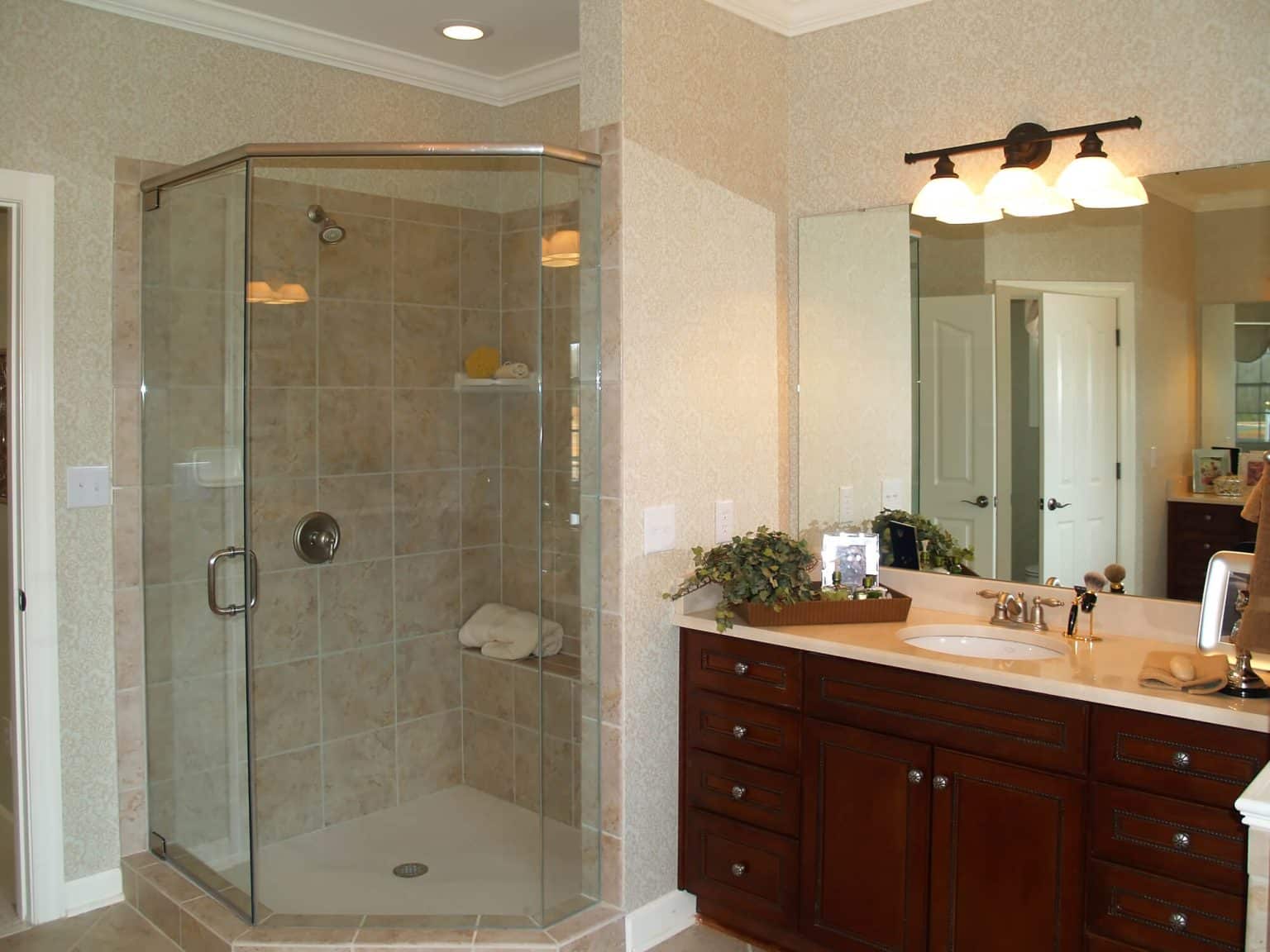 Corner shower enclosure with clear glass doors