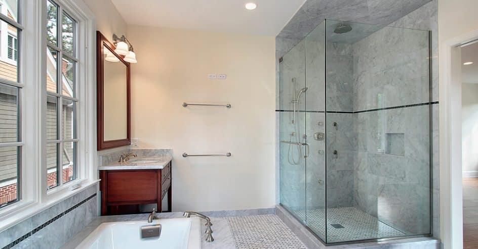 Tiled shower surround beside a bathroom window
